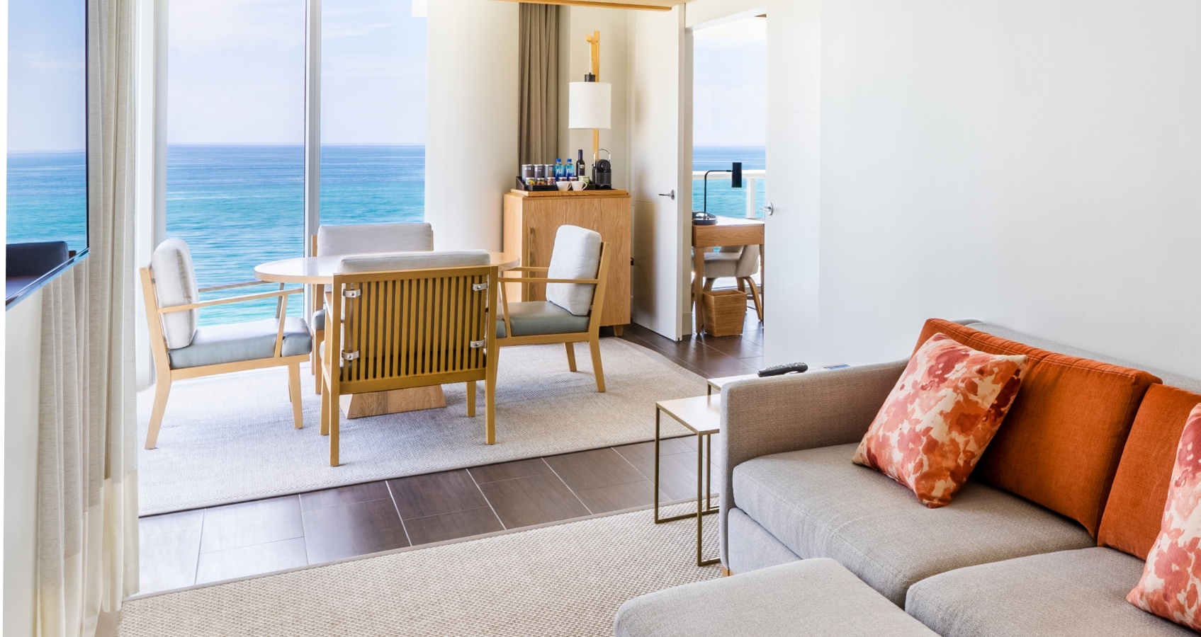 Table and chairs in a deluxe room at Eden Roc