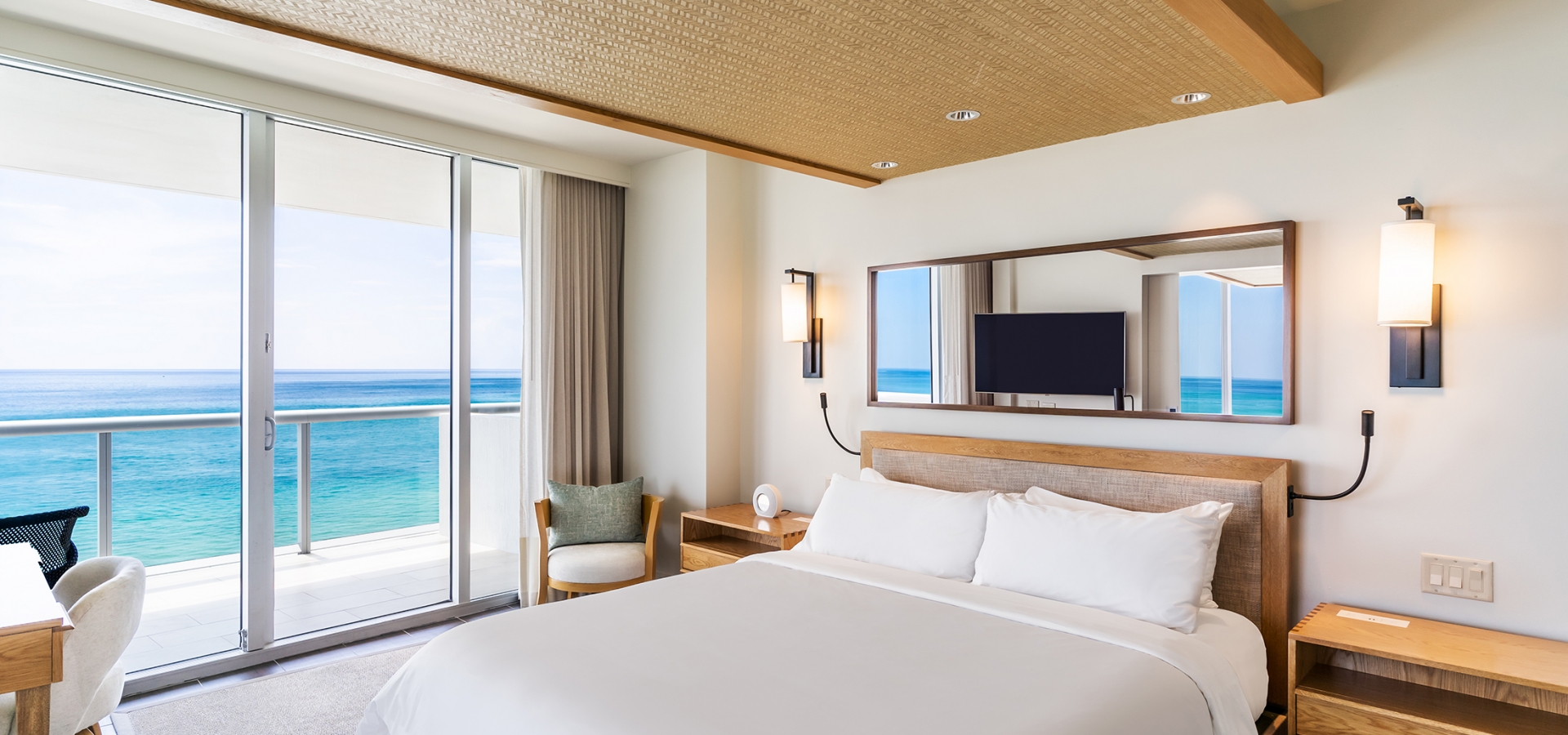 Bed from an Oceanfront Suite at Eden Roc